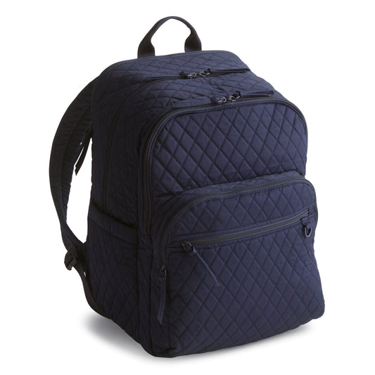 Navy blue quilted backpack on a white background