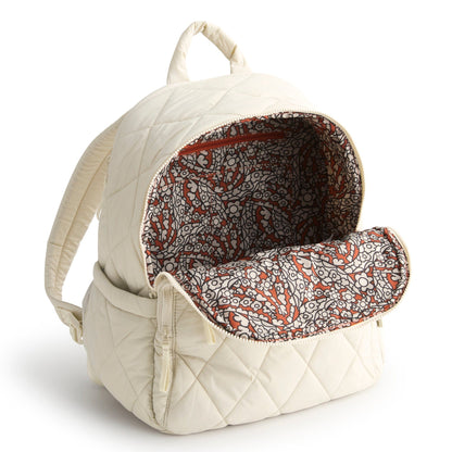 Quilted beige backpack with floral pattern interior on a white background
