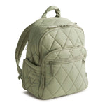 Green quilted backpack on a white background