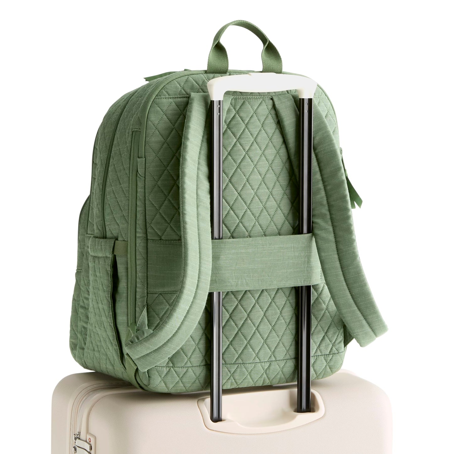 Green quilted backpack with a quilted green panel on a white background